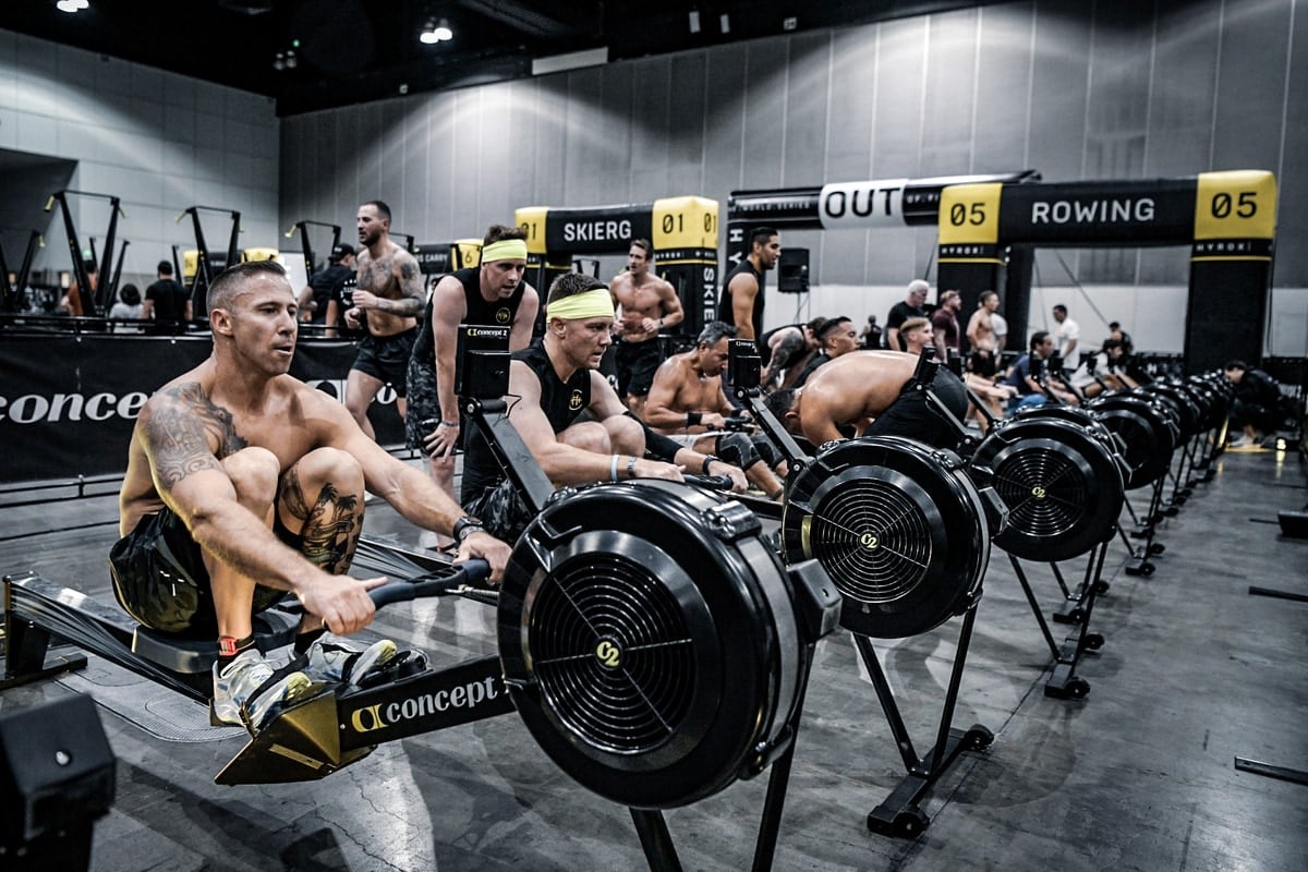 Athletes competing on rowing machines at an official HYROX race — CrossFit Prior Lake is an official HYROX affiliate gym